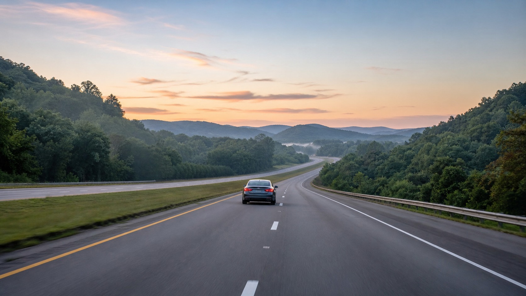 Empty I-65 South highway before dawn with headlights stretching into the dark, early summer morning departure from Louisville to Destin Florida